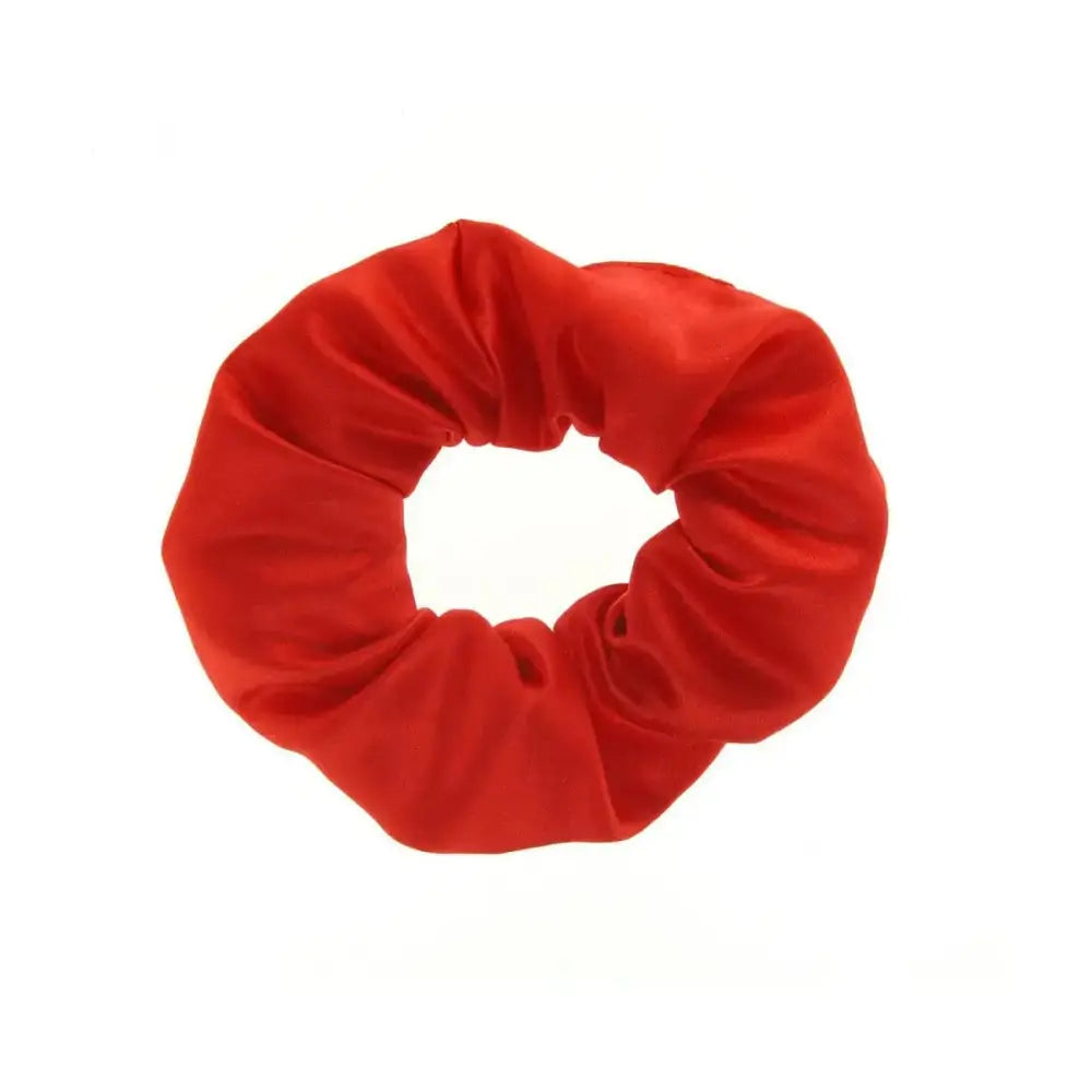 A vibrant red showquest plain scrunchie made of soft polyester duchess satin perfect for stylish hair scrunchies