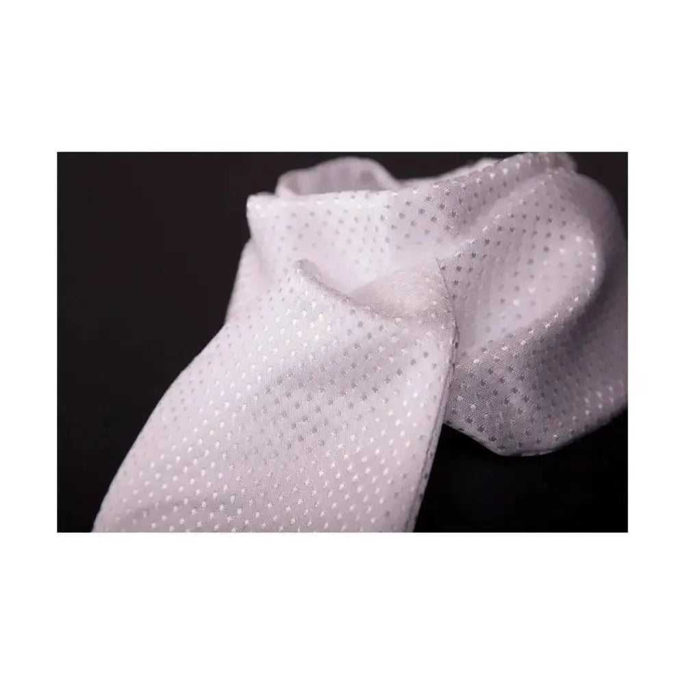A delicate white jacquard woven mesh scarf with subtle silver polka dots from showquest untied devises stock
