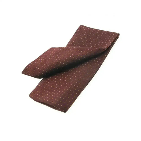 A maroon silk pocket square with subtle white polka dots from showquest untied stocks pin spot collection