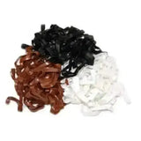 A pile of black brown and white silicone plaiting bands packs perfect for easy plaiting and hair styling