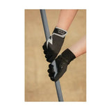 Black silva flash riding gloves with white lightning bolt and gray accents gripping a pole, wind resistant design