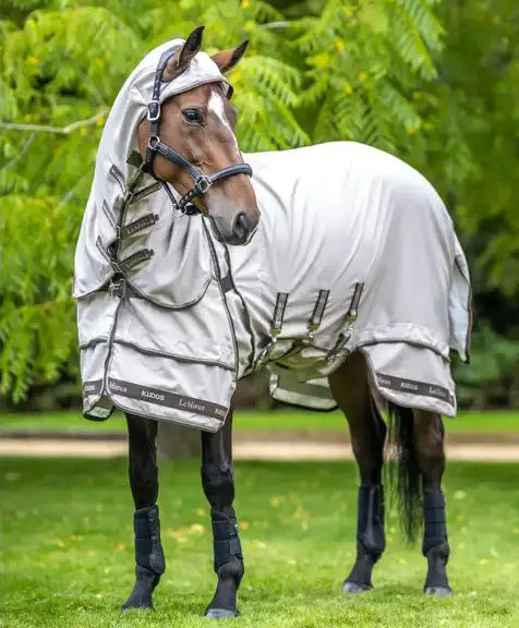 Silver-gray horse blanket with black straps and brand logos, designed for protection against insects and weather.