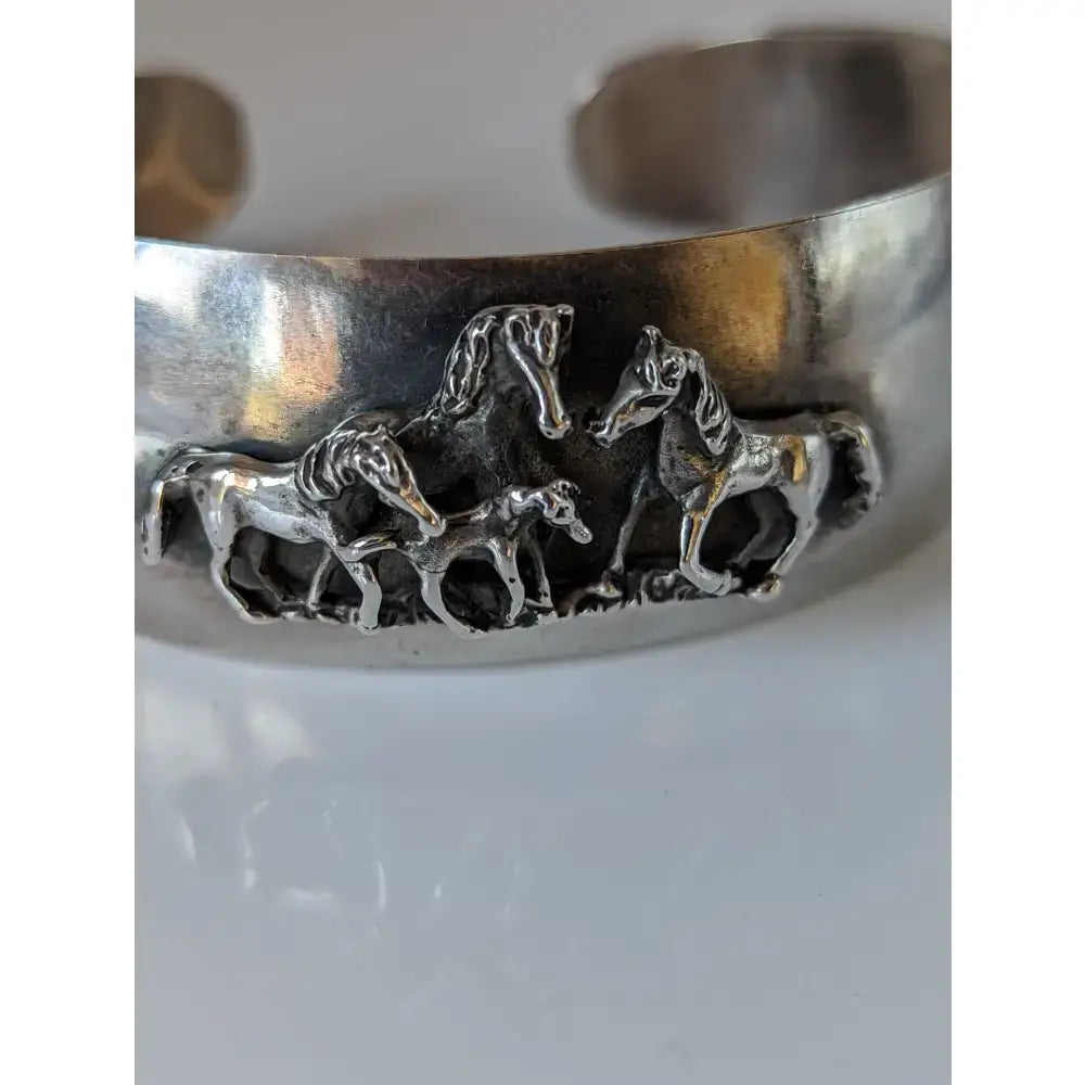 Silver steed herd bangle silver cuff bracelet with detailed 3d relief of four horses in motion equestrian jewelry