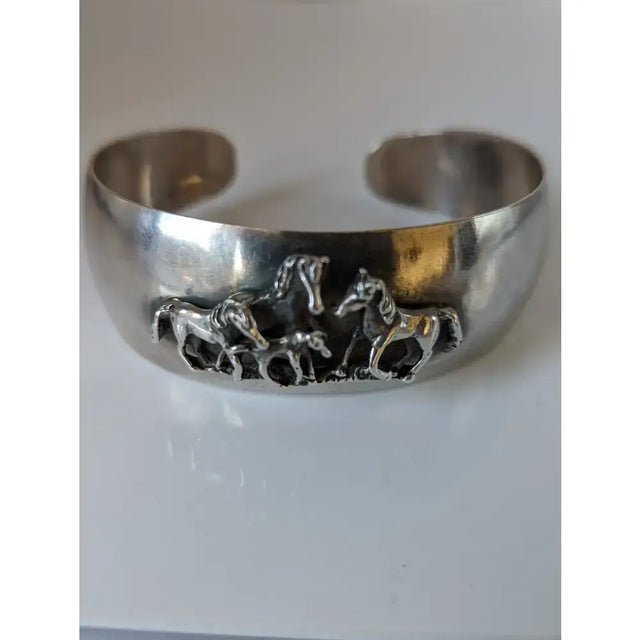 Silver steed silver cuff bracelet with detailed 3d relief of three horses in motion perfect equestrian jewelry herd bangle