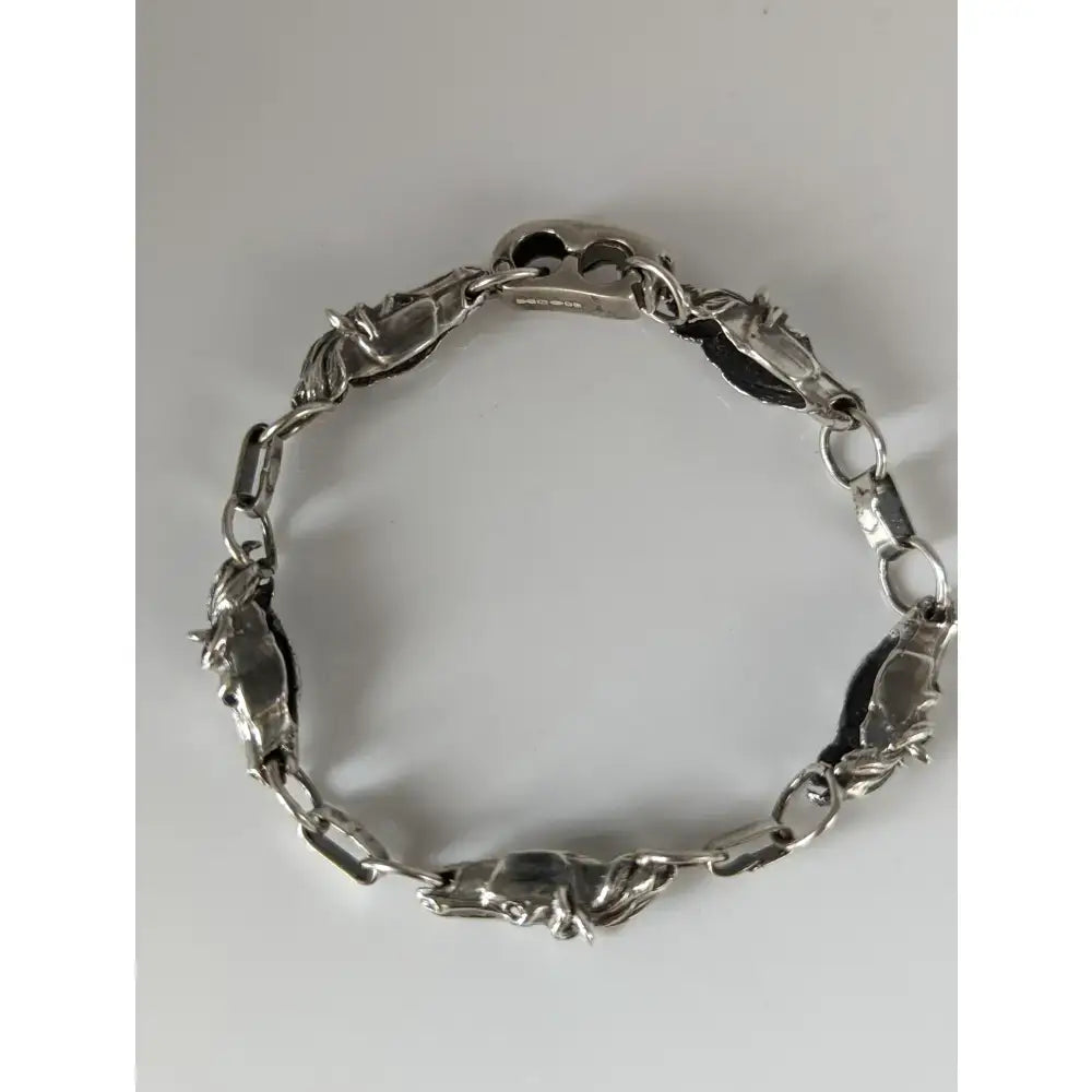 Silver toned steed 3d horse bracelet with detailed horse head links and polished oval chain segments in equestrian jewelry style