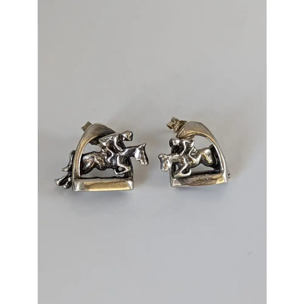 Silver steed stirrup stud earrings with detailed 3d jump horse and rider figures in silver equestrian design