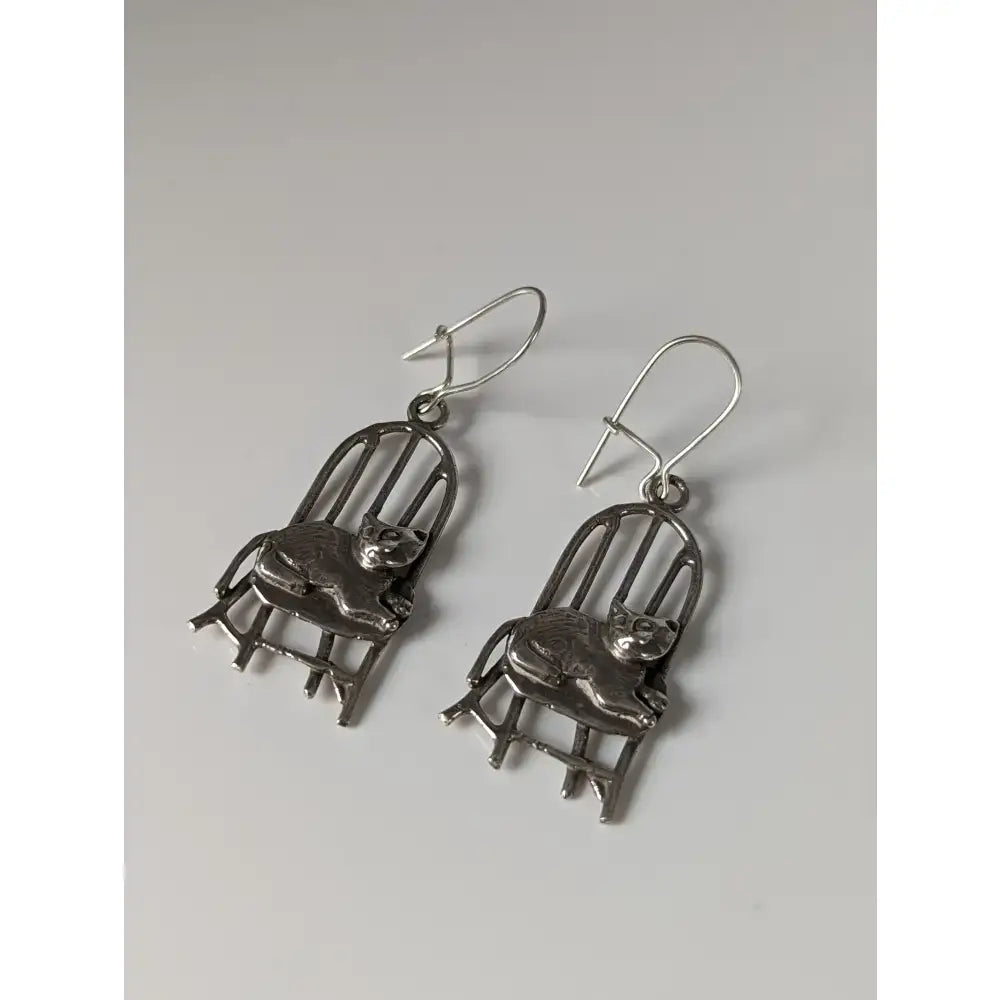 Silver steed handmade silver chair dropped earrings featuring cat on chair design with intricate metalwork and hook closure
