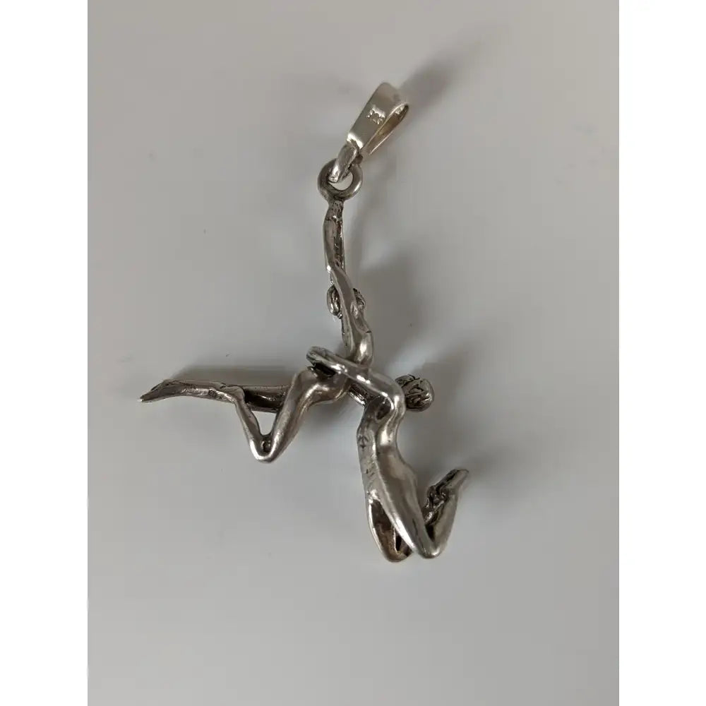 Silver steed acrobats sterling silver pendant with two intertwined acrobats in a dynamic pose