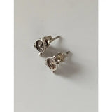 Silver steed alarm clock stud earrings with polished metallic finish and intricate mercedes-benz logo detailing