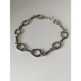 Silver steed horseshoe silver bracelet with polished metallic finish in a horse hoof link design