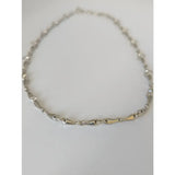 Delicate silver steed snaffle necklace with gold-tone interlocking bone-shaped links for equestrian style