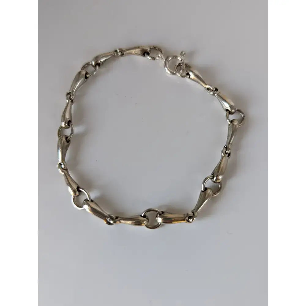 Silver steed snaffles bracelet with delicate silver horsebit link and polished metallic finish in classic design