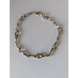 Silver steed snaffles bracelet with delicate silver horsebit link and polished metallic finish in classic design