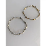 Two silver steed snaffles bracelets with delicate silver and gold-tone mixed-metal horsebit design