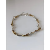 Silver steed snaffles bracelet with delicate silver and gold two-tone chain featuring sleek interlocking links