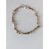 Silver steed two-tone silver and gold snaffles bracelet with delicate silver horsebit design and secure clasp