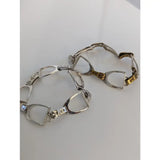 Silver steed stirrups bracelet with silver and gold-tone horsebit design and sparkling diamond accents in equestrian style