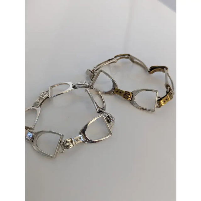 Silver steed stirrups bracelet with silver and gold-tone horsebit design and sparkling diamond accents in equestrian style