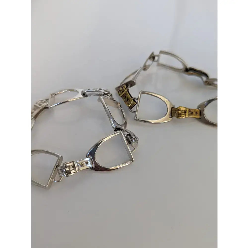 Silver steed stirrups bracelet with gold and silver toned horsebit polished metal links in equestrian design