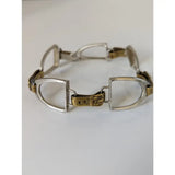 Silver steed stirrups bracelet with silver and gold toned horsebit style and ornate equestrian design buckle