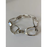 Silver steed stirrups bracelet with polished silver horsebit links and detailed engraved clasp in equestrian design