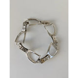 Silver steed stirrups bracelet in silver with diamond accents and a secure clasp featuring equestrian design