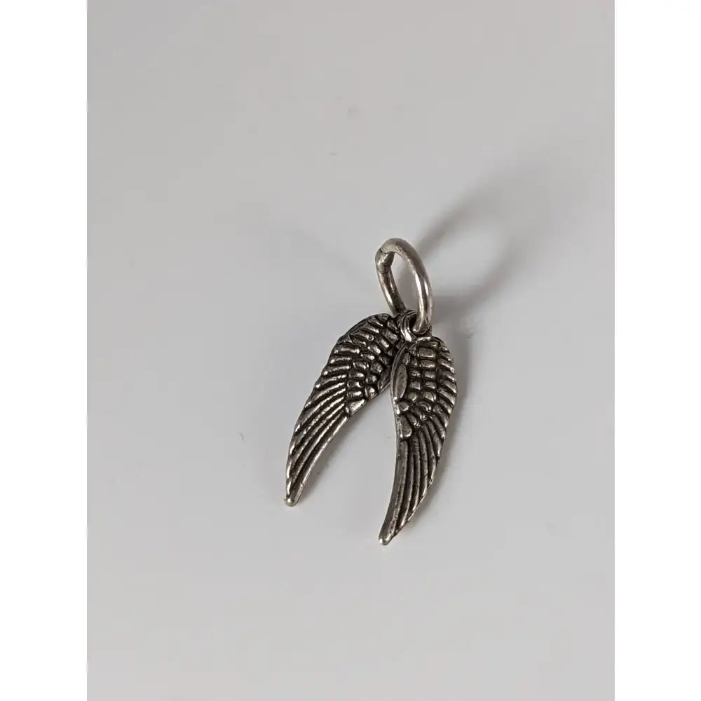Silver steed angel wings silver pendant featuring a detailed silver angel wing charm with a small loop at the top