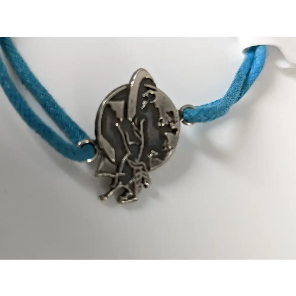 Silver steed world bracelet with silver-toned circular pendant featuring equestrian winged figure on blue braided cord