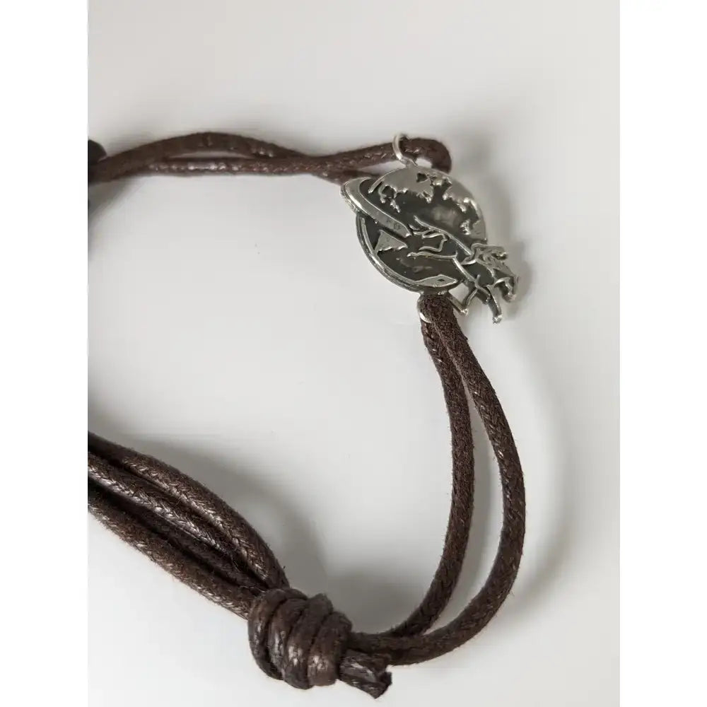 Brown leather cord silver steed world bracelet with silver-toned planet and equestrian figure charm