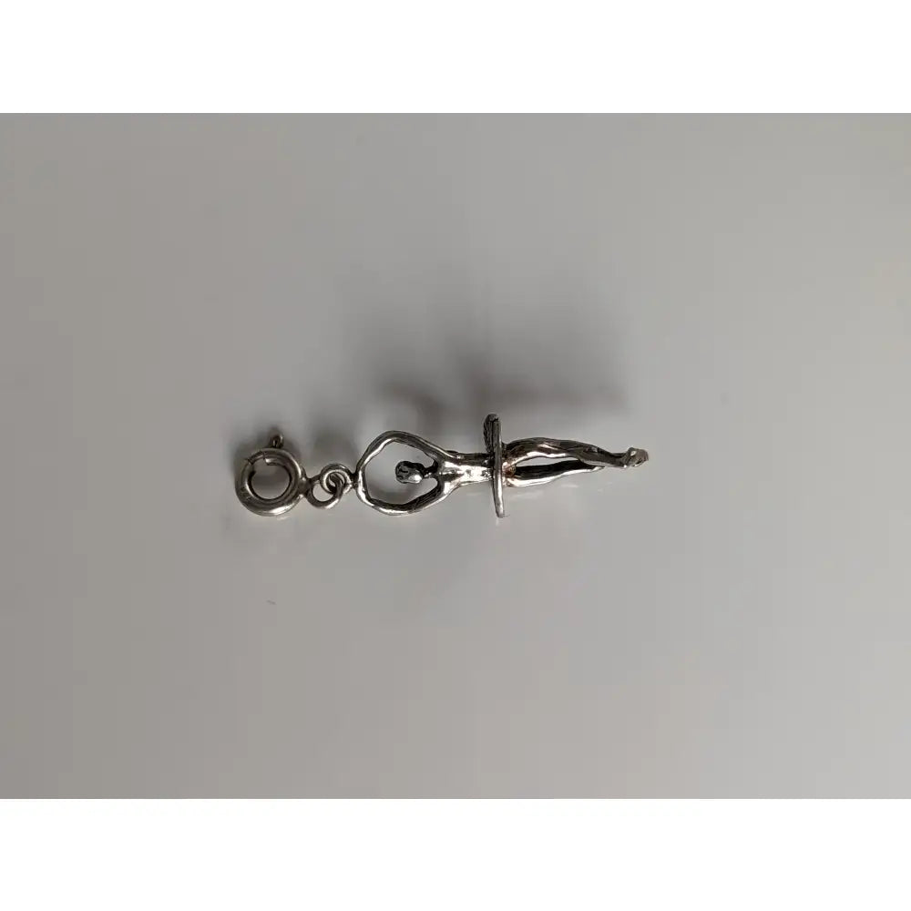 Silver steed ballet dancer silver charm showing a silver metal figure in an acrobatic pose with a hanging ring