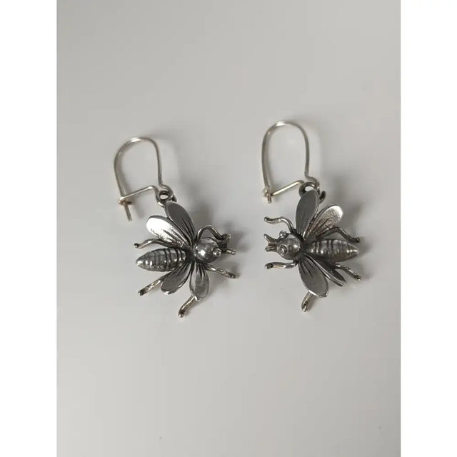 Silver steed bee dropped earrings with detailed wings and polished finish handmade silver jewelry perfect for equestrian jewelry fans