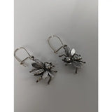 Silver steed bee dropped earrings featuring handmade silver jewelry with detailed wings and polished metallic finish