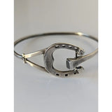 Silver steed big sterling silver horseshoe bangle with heart cutout and black dot details along the edge