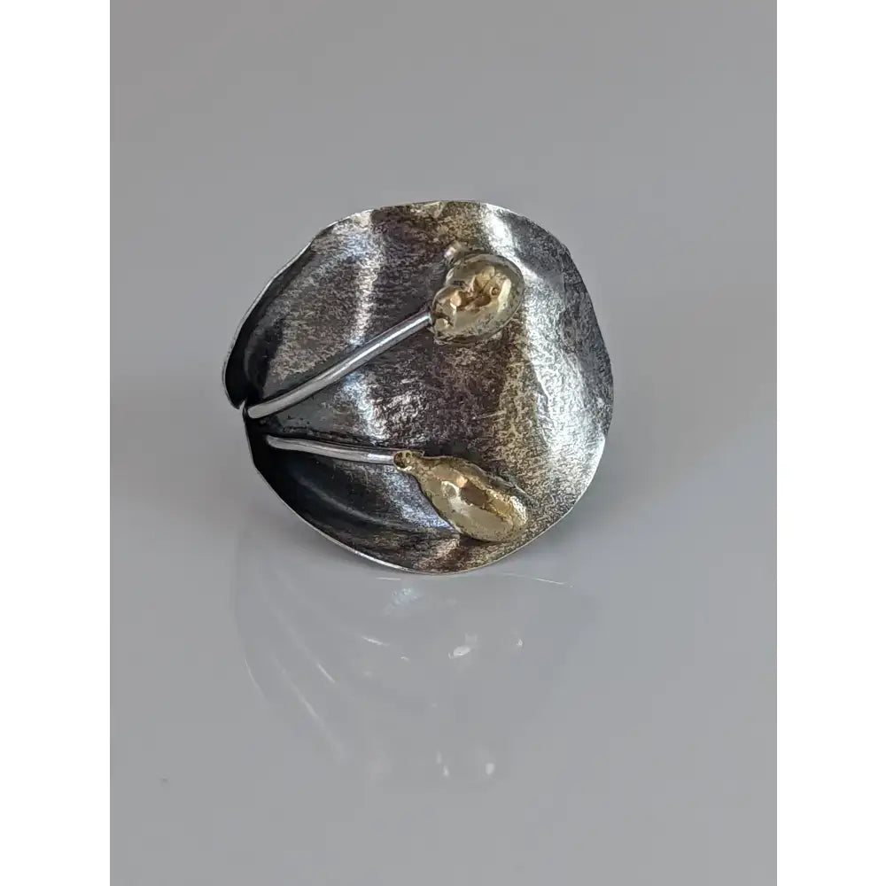 Silver steed big leaf sterling silver ring with hammered texture and two gold teardrop accents in an ornament style