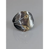 Silver steed big leaf sterling silver ring with hammered texture and two gold teardrop accents in an ornament style