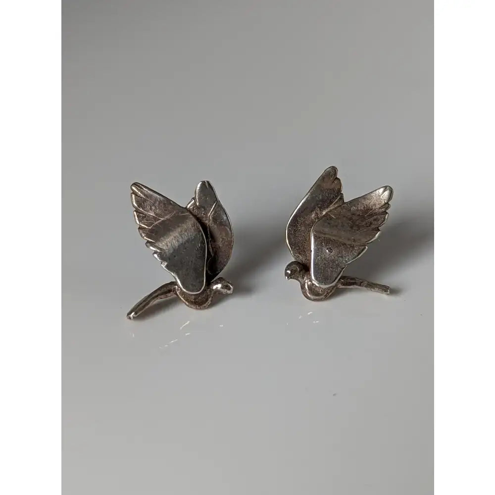 Silver steed bird stud earrings featuring detailed wing and body craftsmanship in shiny silver bird stud earrings design