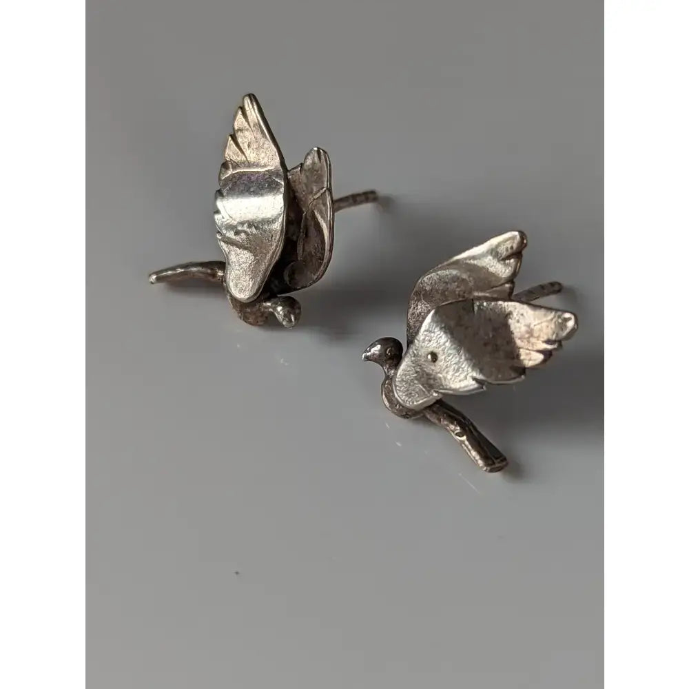 Silver steed bird stud earrings with detailed wings and textured silver bodies perfect as bird stud earrings