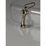 Silver steed bone silver pendant featuring a silver bone shaped charm with a loop for attaching as a silver pendant