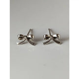Silver steed bow stud earrings with a polished metallic finish in silver perfect for everyday wear