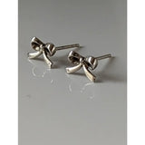 Silver steed bow stud earrings made of polished silver with a shiny metallic finish perfect for everyday wear