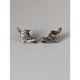 Silver steed broken boot stud earrings featuring silver ice skate-shaped stud earrings with detailed lacing and blade design