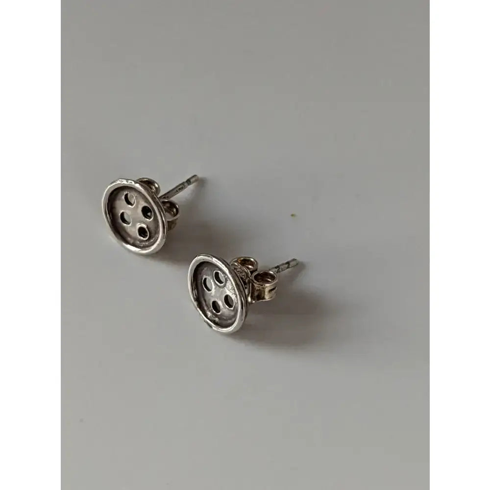 Silver steed button stud earrings silver button-shaped stud earrings with four holes and polished finish