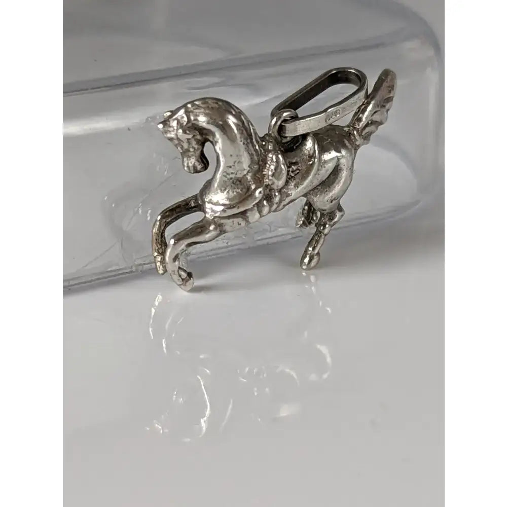 Silver steed carousel horse silver pendant featuring a detailed sculpted silver pendant with a polished finish