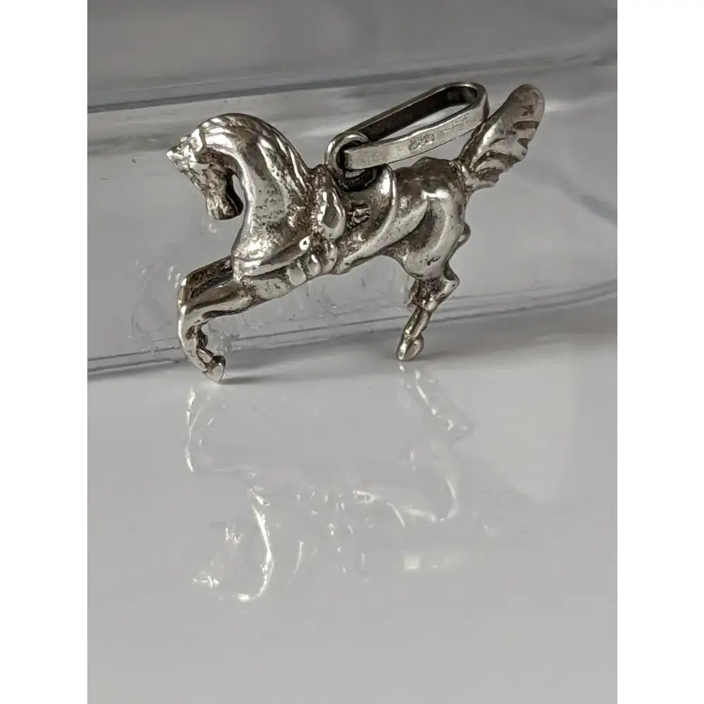 Silver steed carousel horse silver pendant with detailed sculpted features and polished silver metallic finish