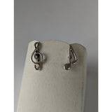 Silver steed celf and note stud earrings in silver featuring treble clef and eighth note musical designs