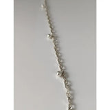 Silver steed chain silver bracelet with ball charms and small spherical beads spaced along the silver chain anklet