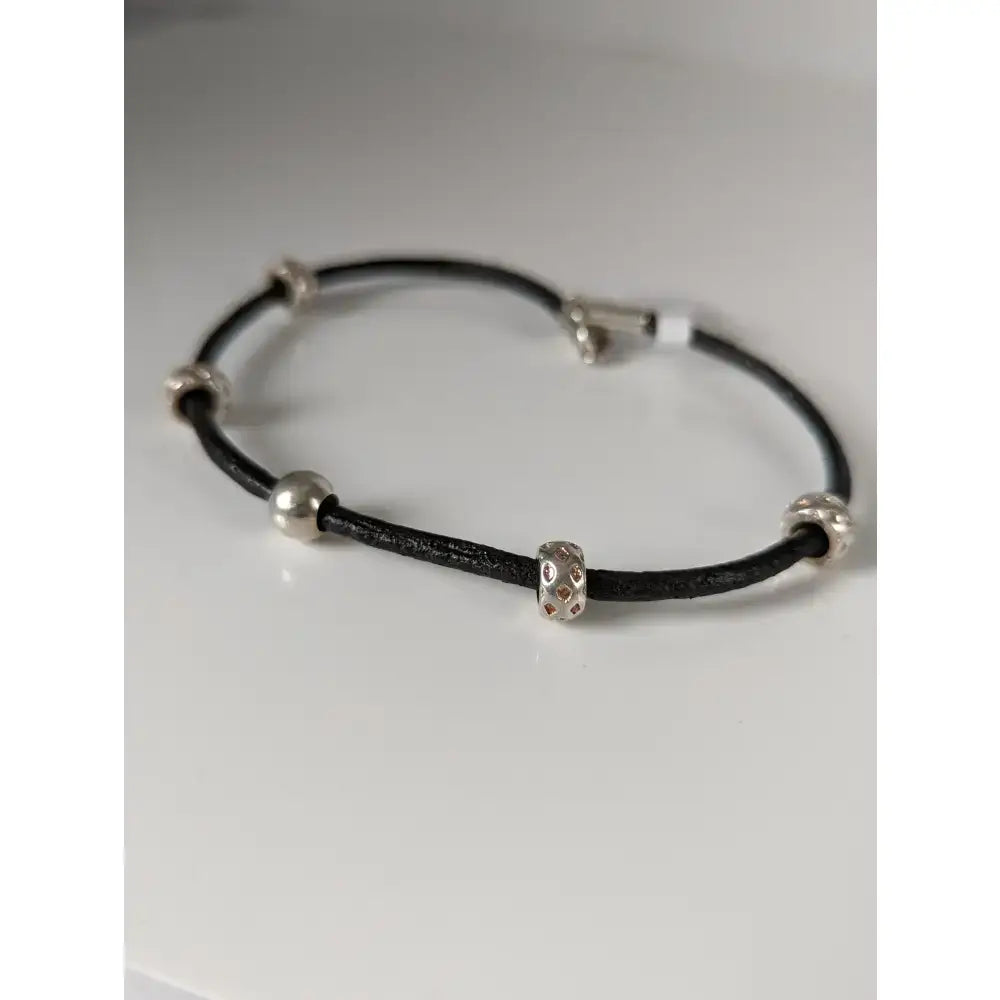 Silver steed charms leather cord bracelet with black 26cm leather and silver-toned beads featuring a detailed center bead