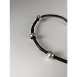 Black leather cord bracelet with silver steed charms and silver-toned spherical beads on 26cm leather cord