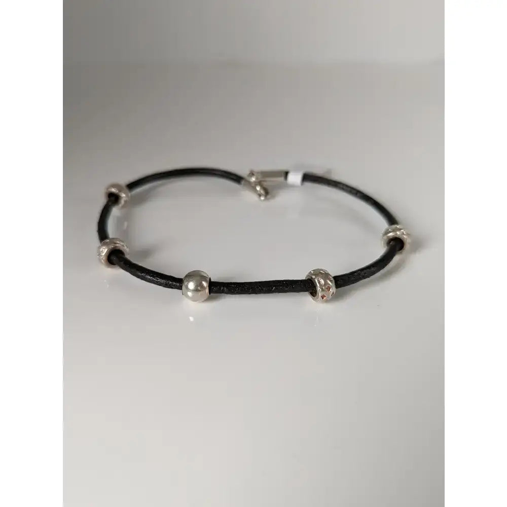 Black leather cord bracelet with silver steed charms silver toned beads and matching clasp on 26cm leather cord