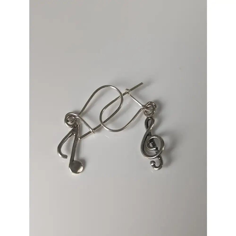Silver steed clef and note dropped earrings in sleek silver with minimalist musical note design